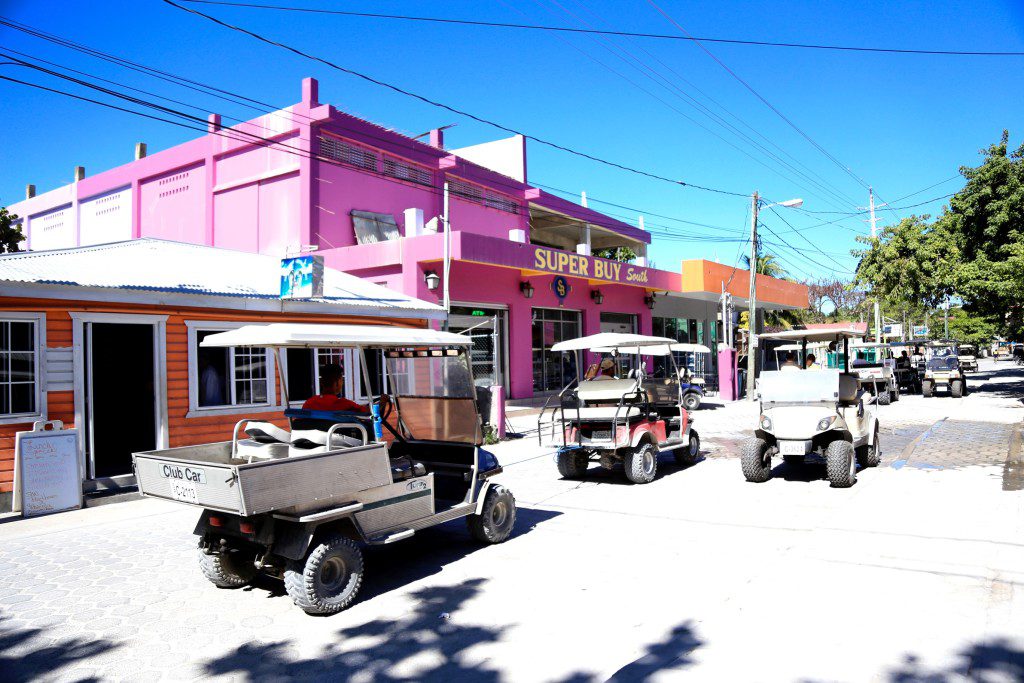 Golf carts on busy road