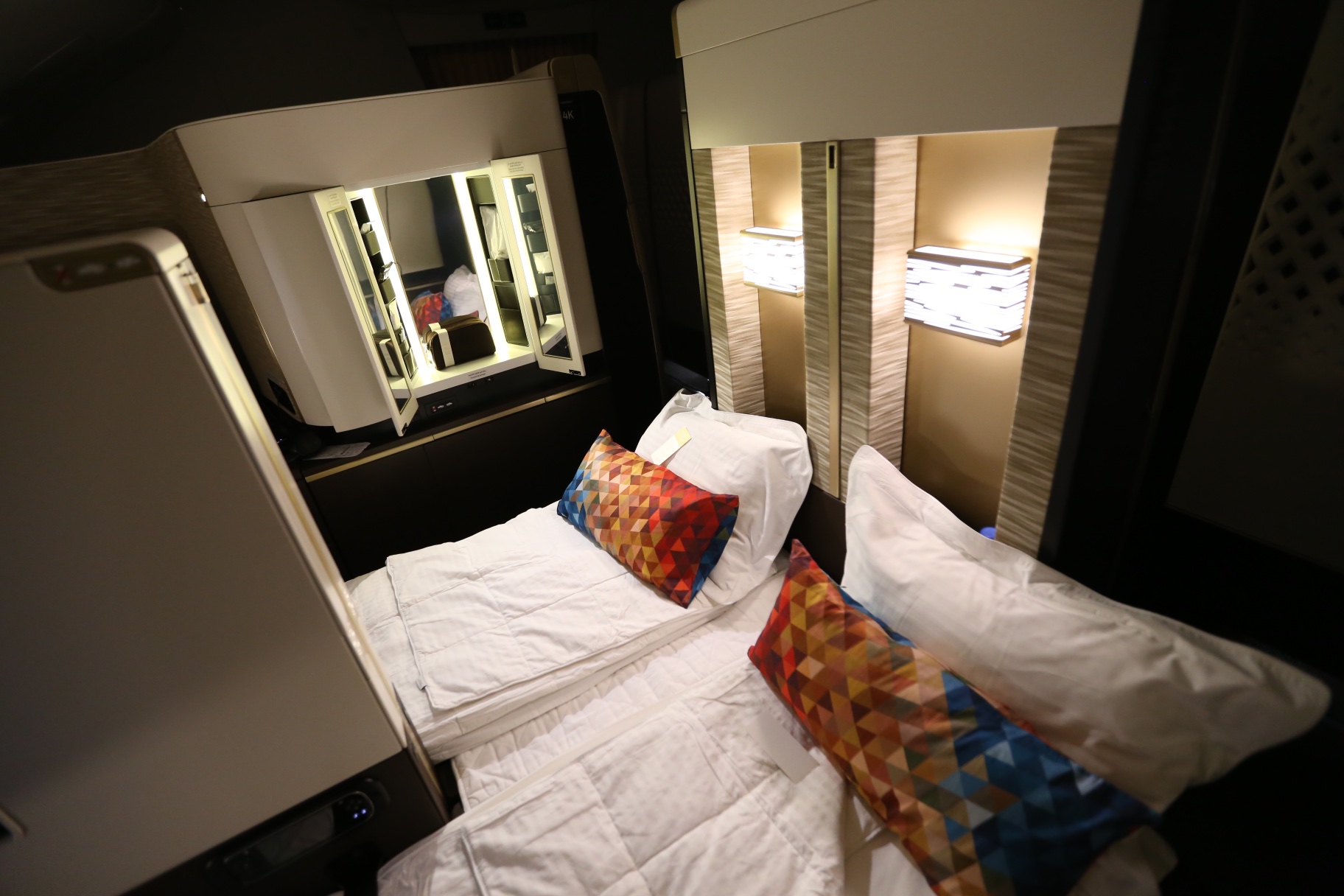 Etihad first class suite with beds made.