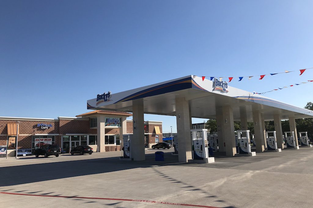 Exterior of gas station with pumps.