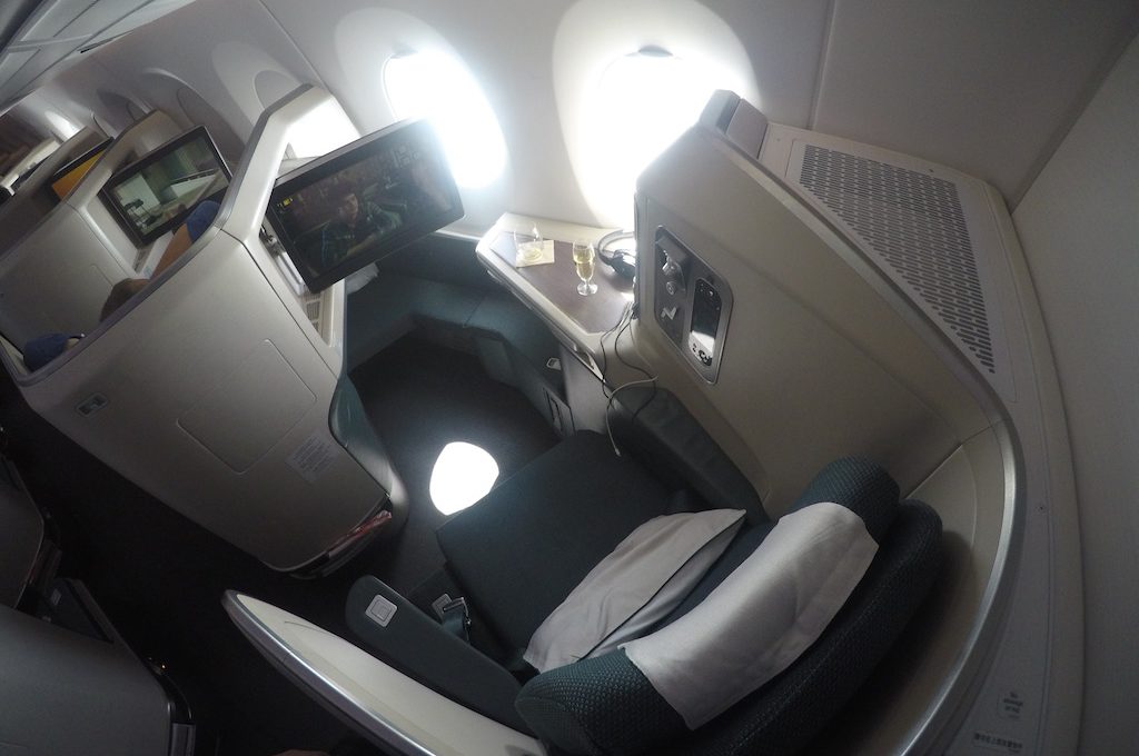 Cathay Pacific business class window seat with screen out.