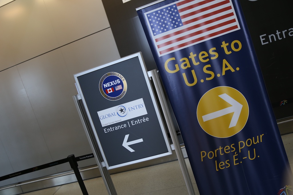 Picture of a global entry sign at an airport.