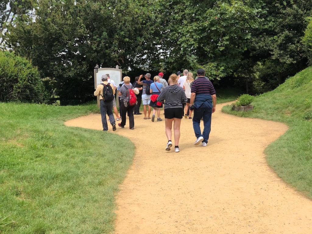 Group walking at Hobbiton Movie Set Tour