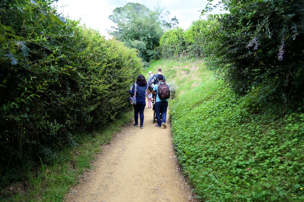 Group walking at Hobbiton Movie Set Tour