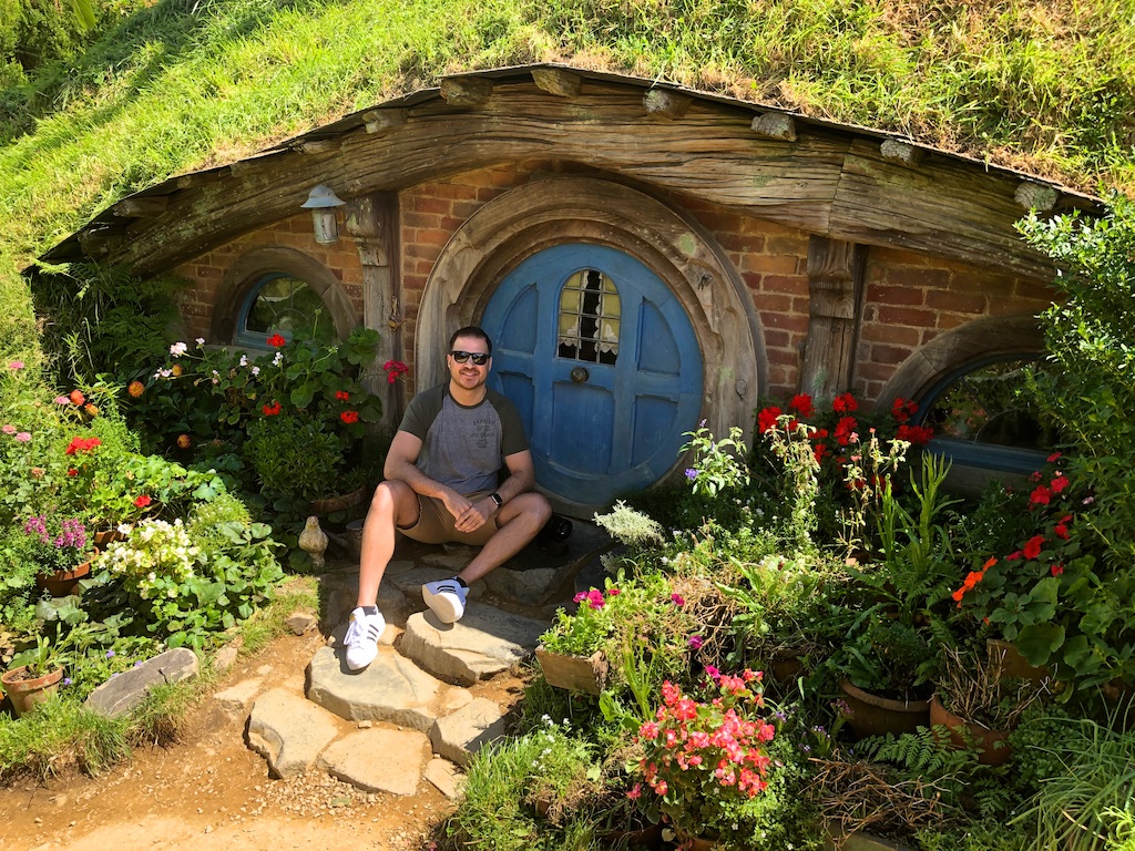 Man at hobbit hole Hobbiton Movie Set Tour