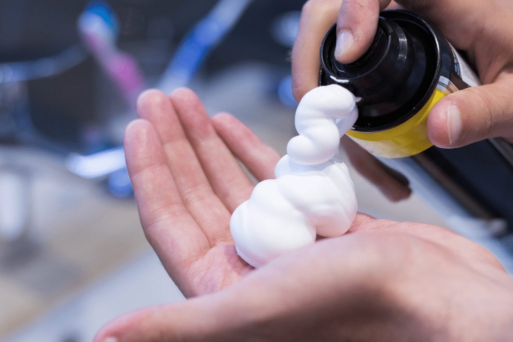 Picture of shaving cream going into hand