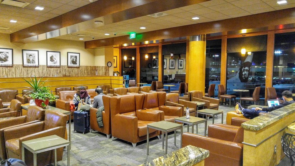 Alaska lounge seating area with views of tarmac