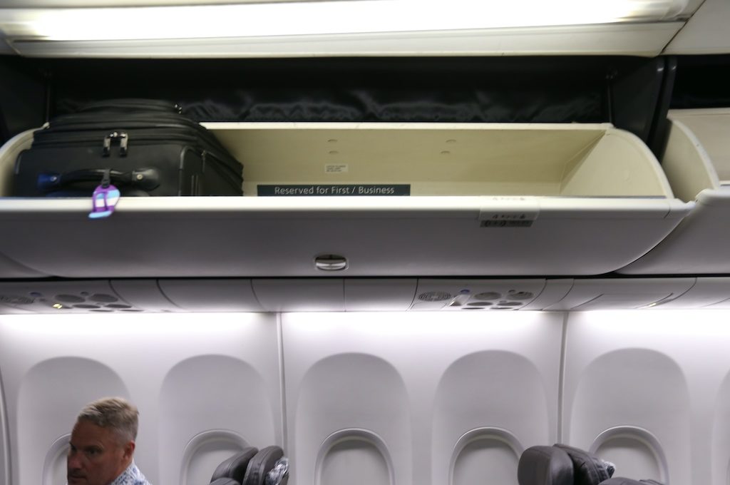 Overhead storage bin reserved for first class