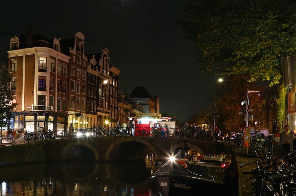 Bikes lining the canals Amsterdam at night