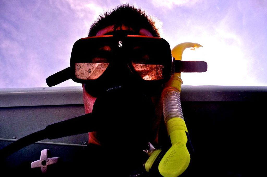 Man wearing snorkel and face mask