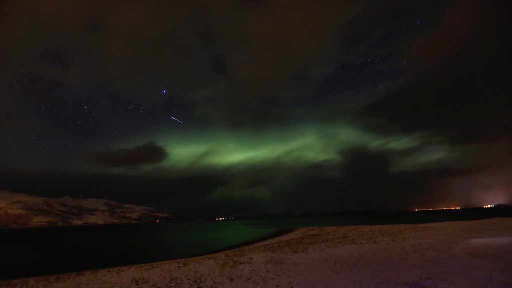 Northern lights and shooting star Norway