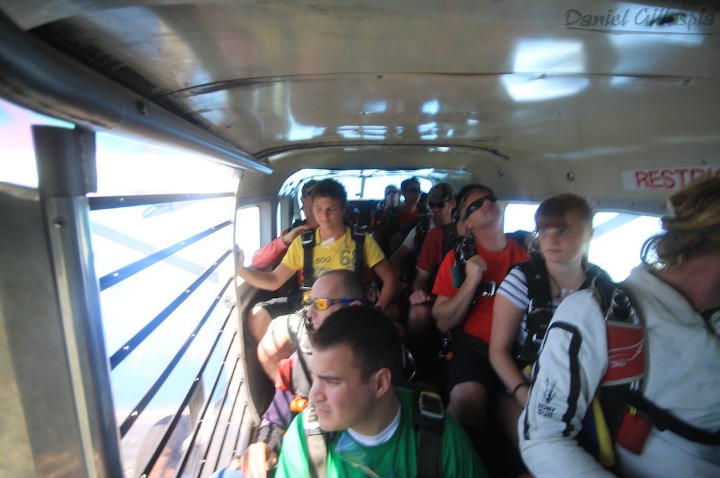 Skydivers in plane waiting to jump