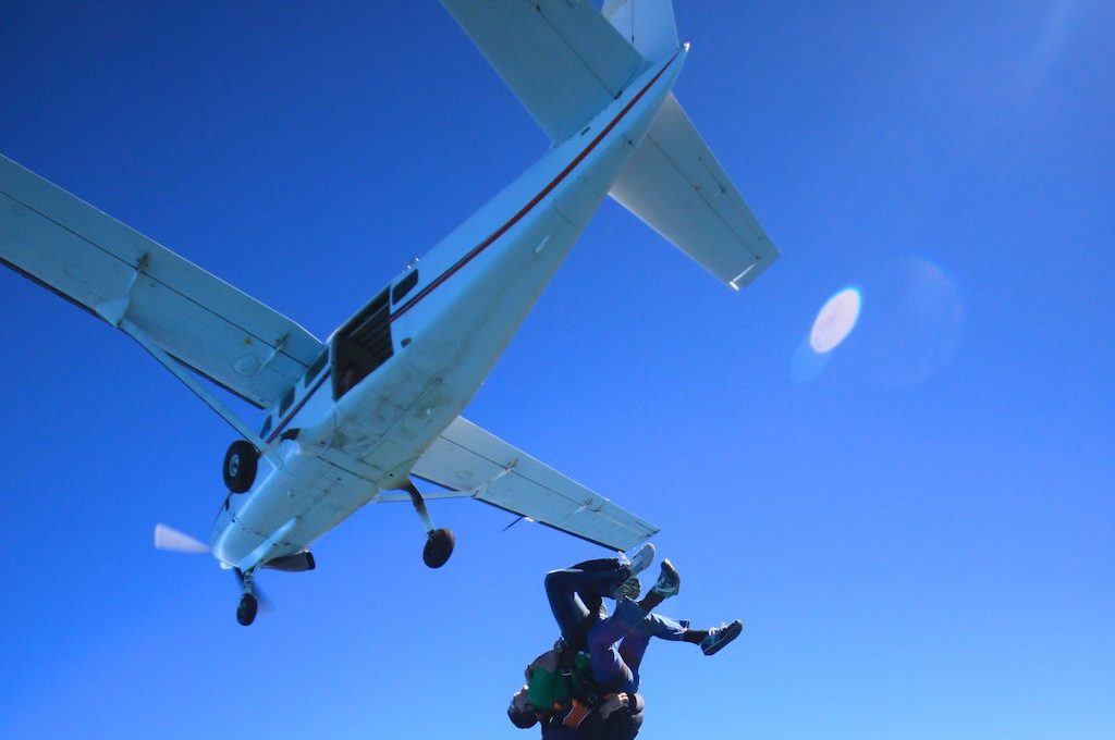 Skydivers jumping out of plane