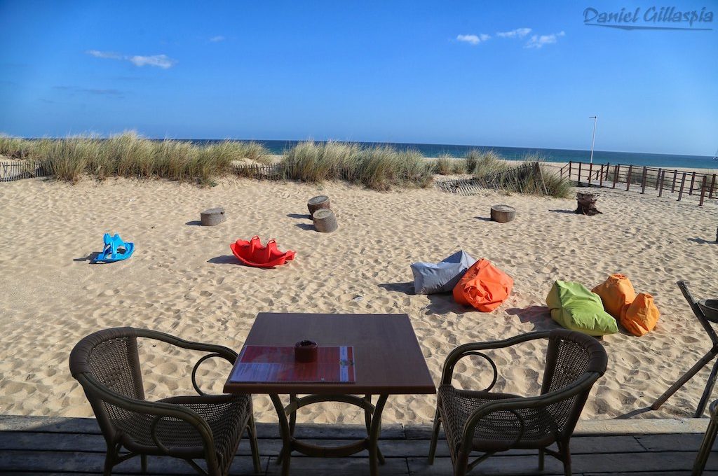 Table and chairs on beach