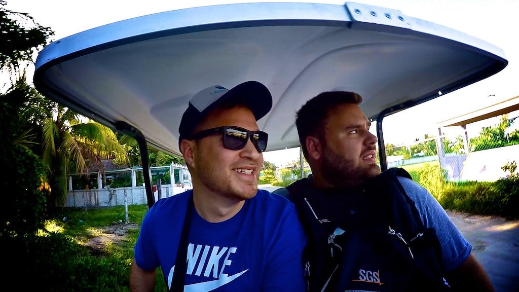 Two men in golf cart