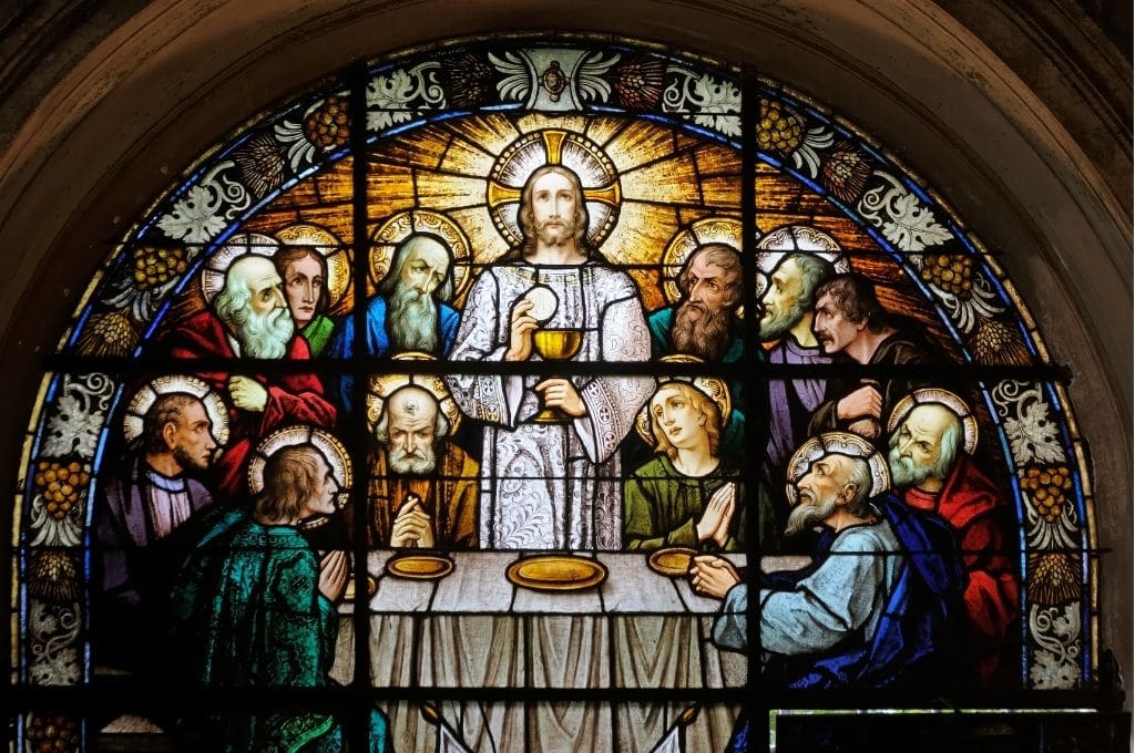 Stained glass picture of 12 disciples last supper