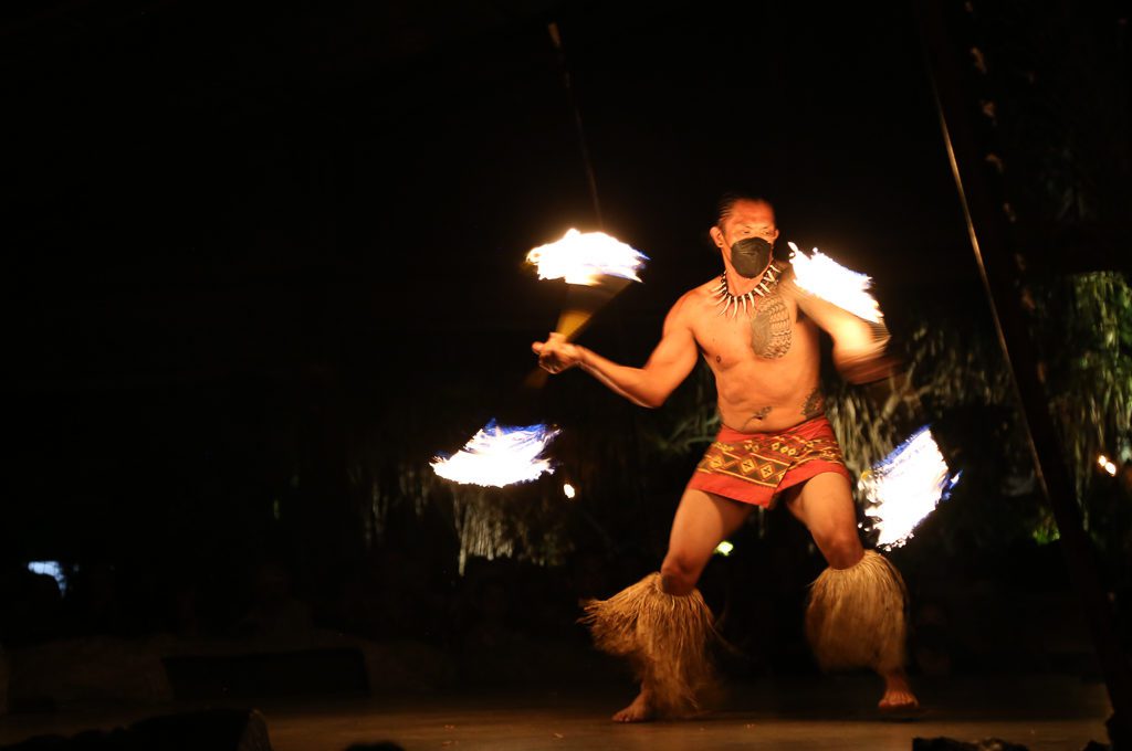 man fire dancing at luau Hawaii
