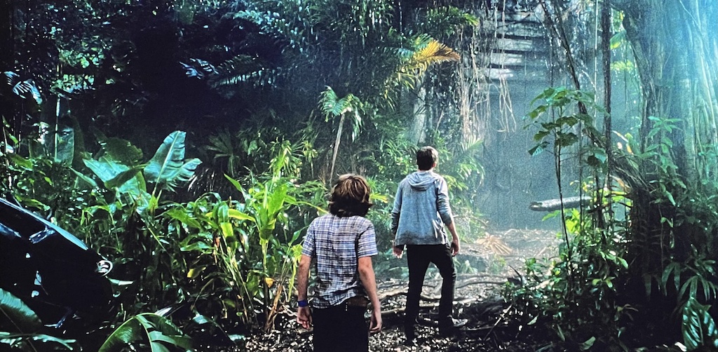 Paradise Park, boys approaching abandoned building Jurassic World movie scene.