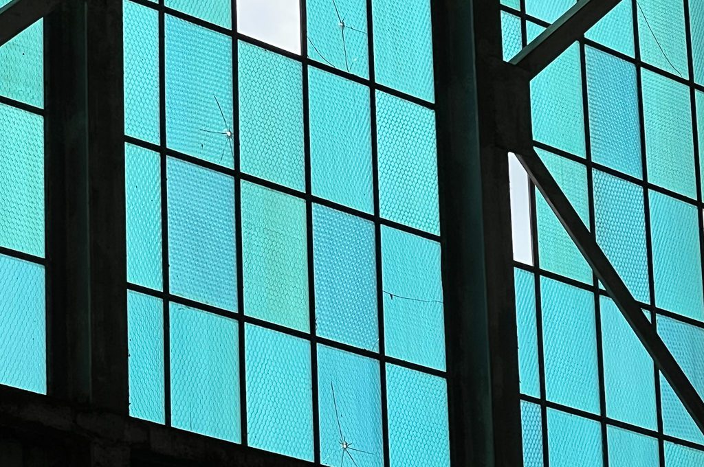 hangar window with bullet holes