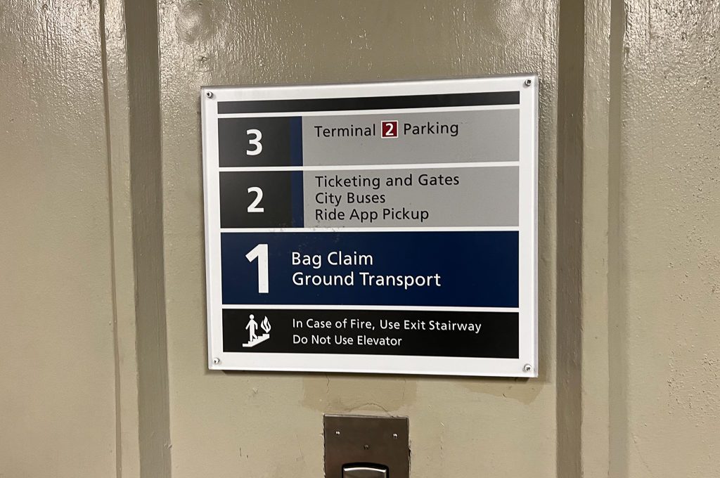 HNL Uber ride share pickup zone signs