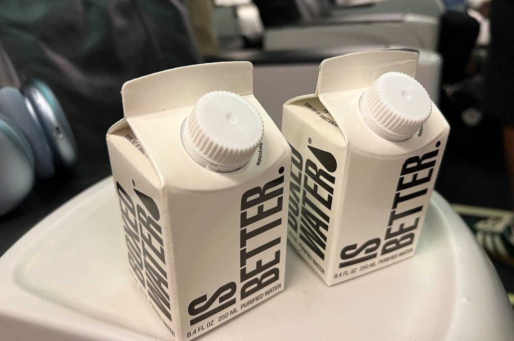 Alaska airlines first class 737-900 MAX boxed water