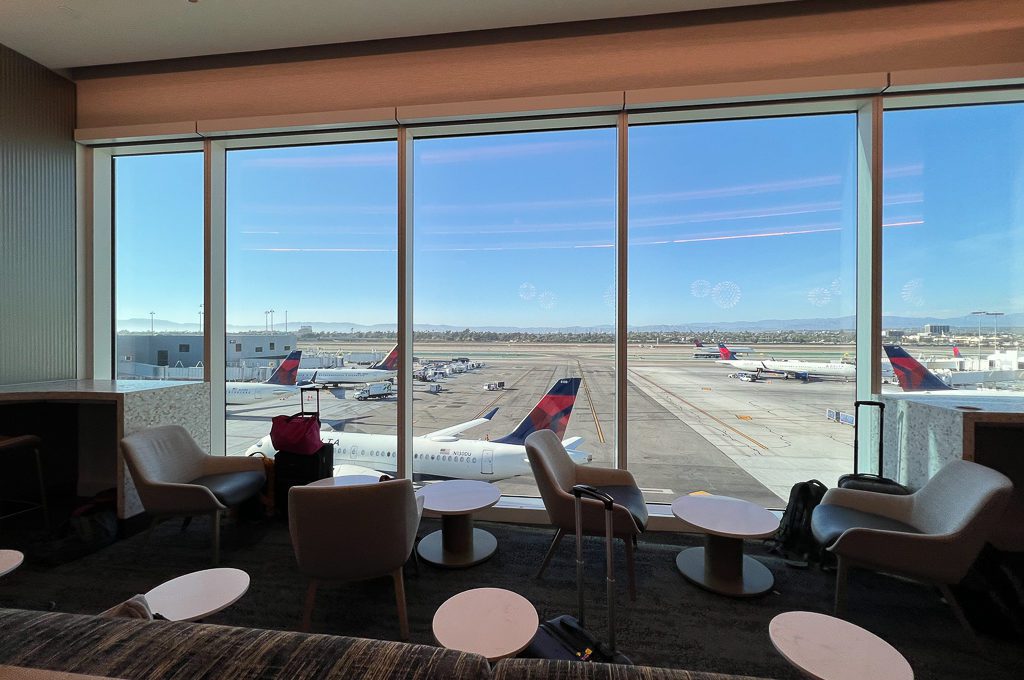 Delta Sky Club LAX seating with outside view of planes