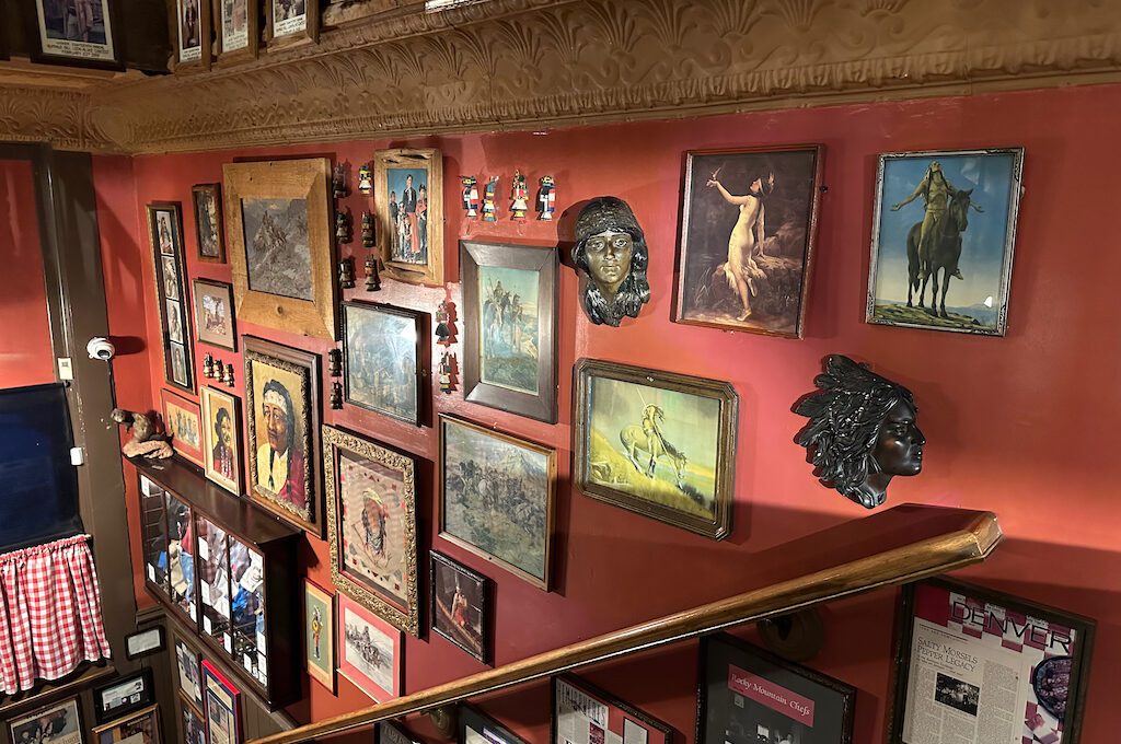 A staircase with pictures on the wall