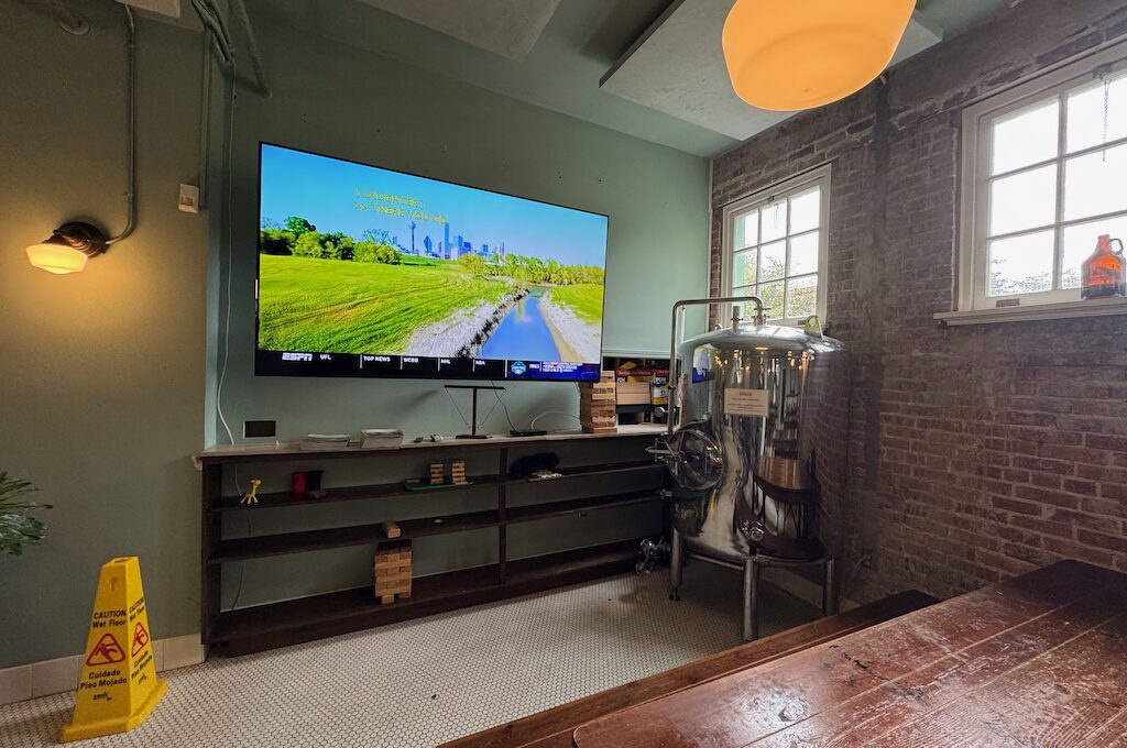 Large TV in up stairs dining area Superior Bathhouse Brewery