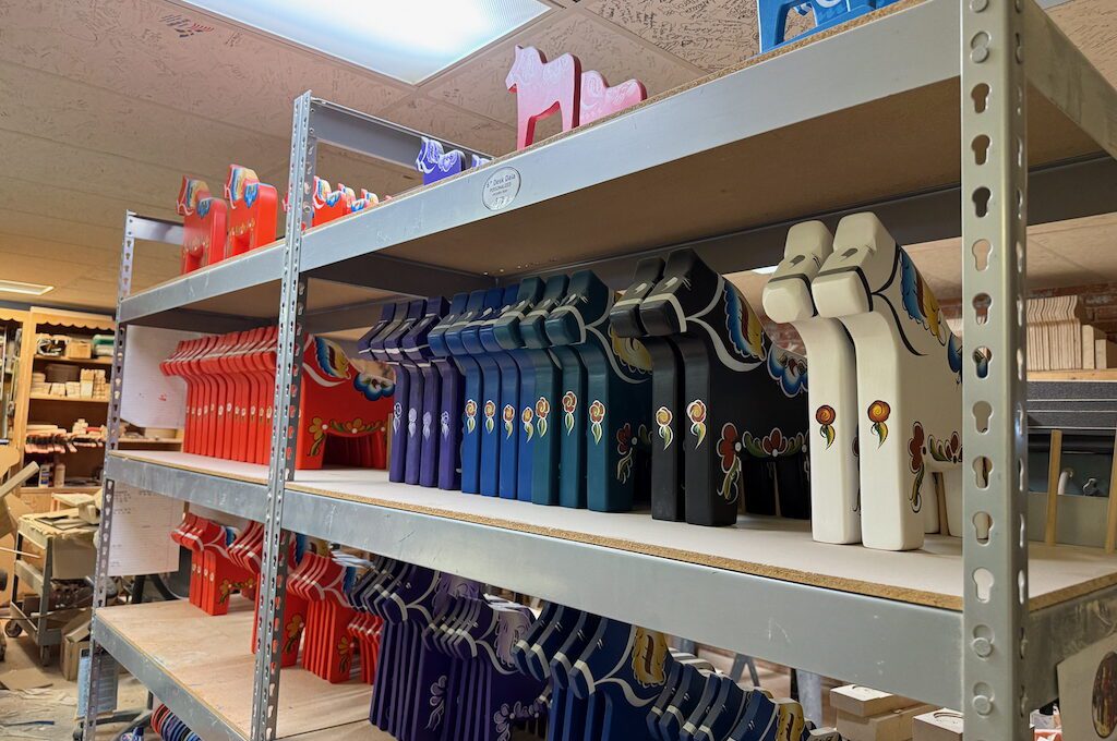Dala horses on shelves in Hemslöjd, Inc