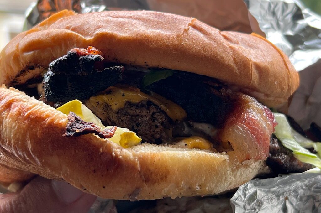 Burger with bacon and cheese at Pucker Wilson's Juneau