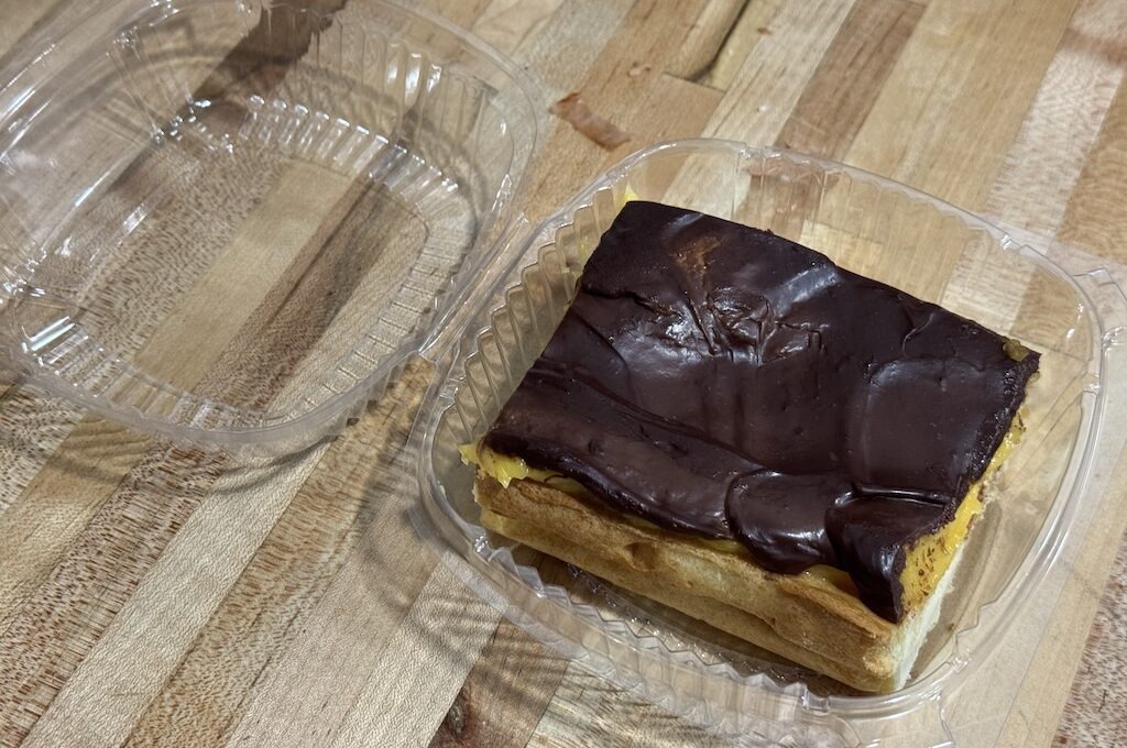 Chocolate eclair in plastic container