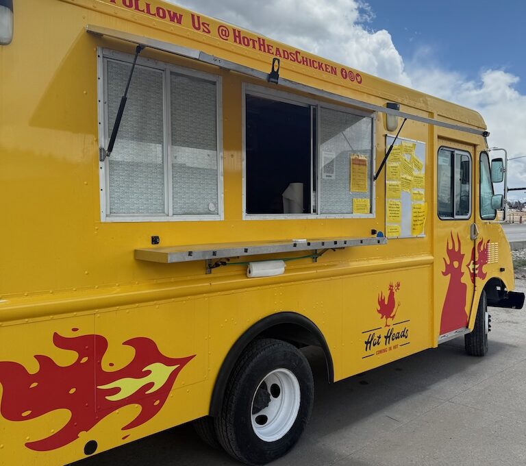Yellow food truck with red flames