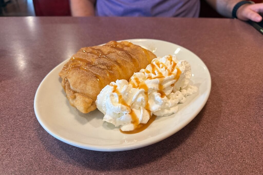 Banana pudding stuffed sopapilla with whipped cream