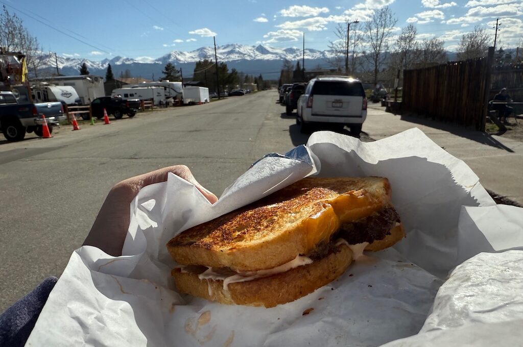 Patty melt with mountains in background