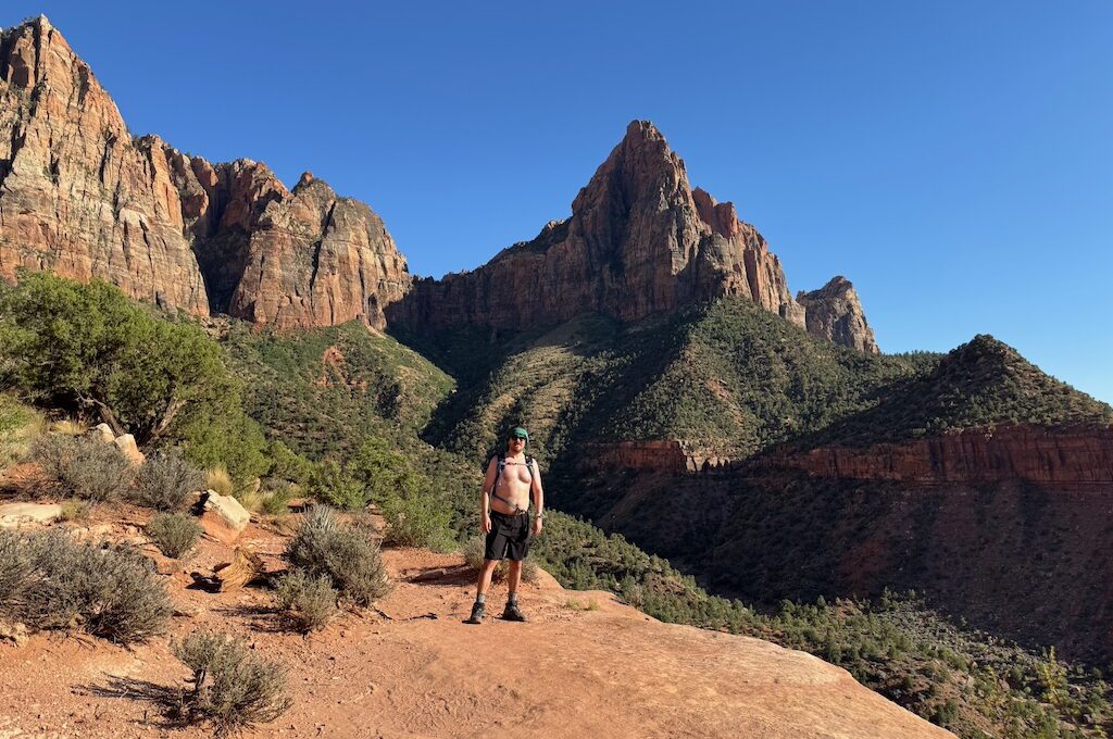 Shirtless Hiker standing in front of the watchmen