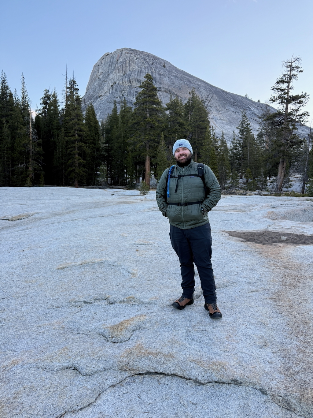 Man standing in front of Stone mountain with trees surrounding